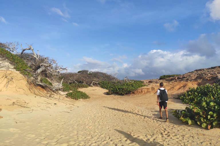 Hiking through the dunes near Aruba's Natural Pool